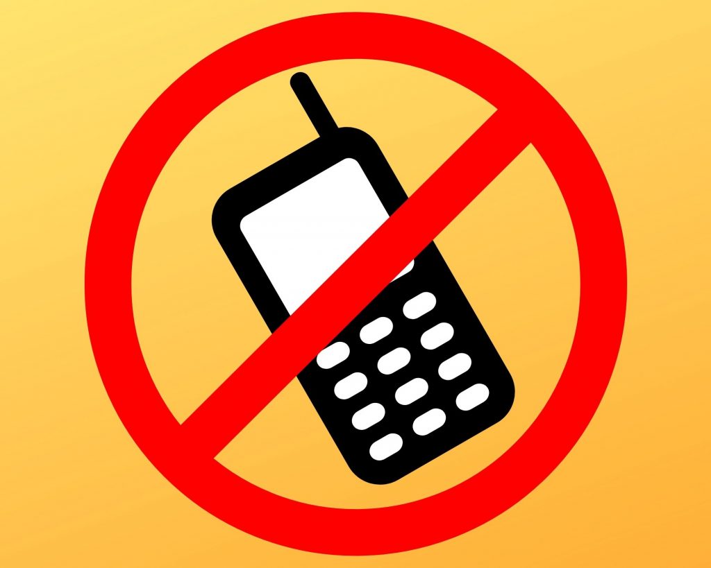 Red ban symbol over a cell phone - tips for overwhelmed moms