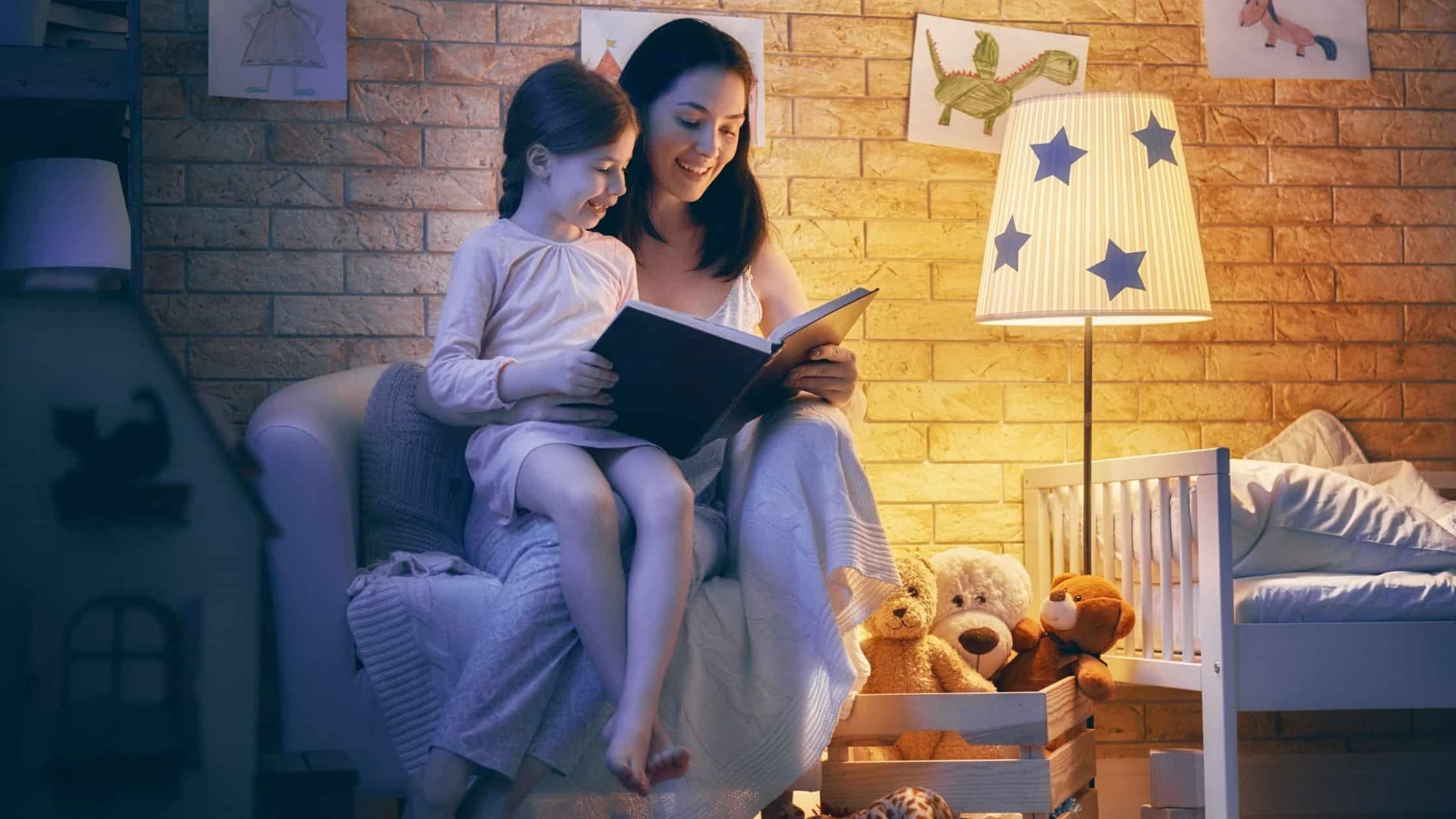 mom and daughter reading together at bedtime