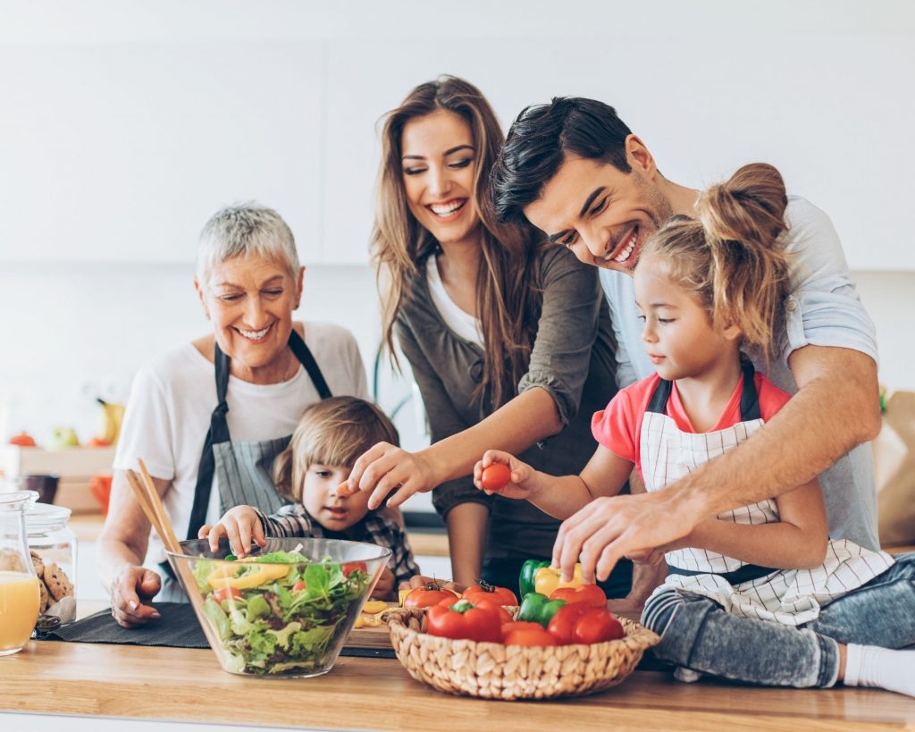Family activities that build healthy habits - family talking about healthy food