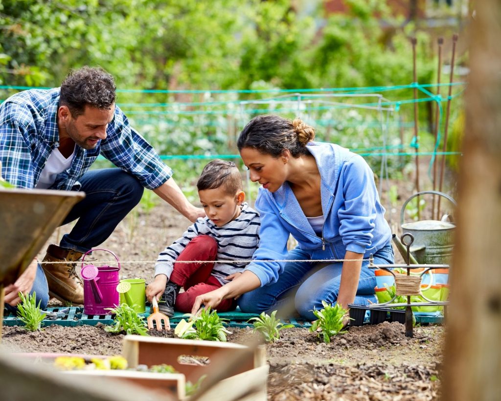 Family activities that build healthy habits - family gardening together