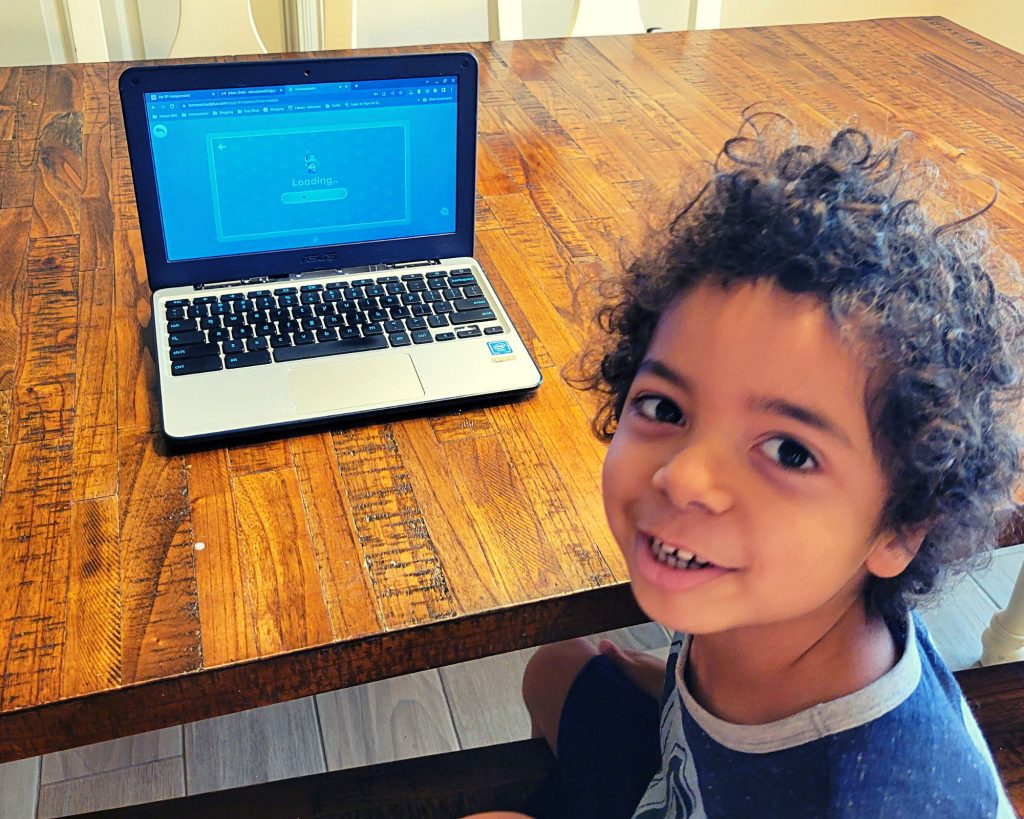 Boy using Homeschool+, an interactive online homeschool curriculum for Prek-2nd grade.