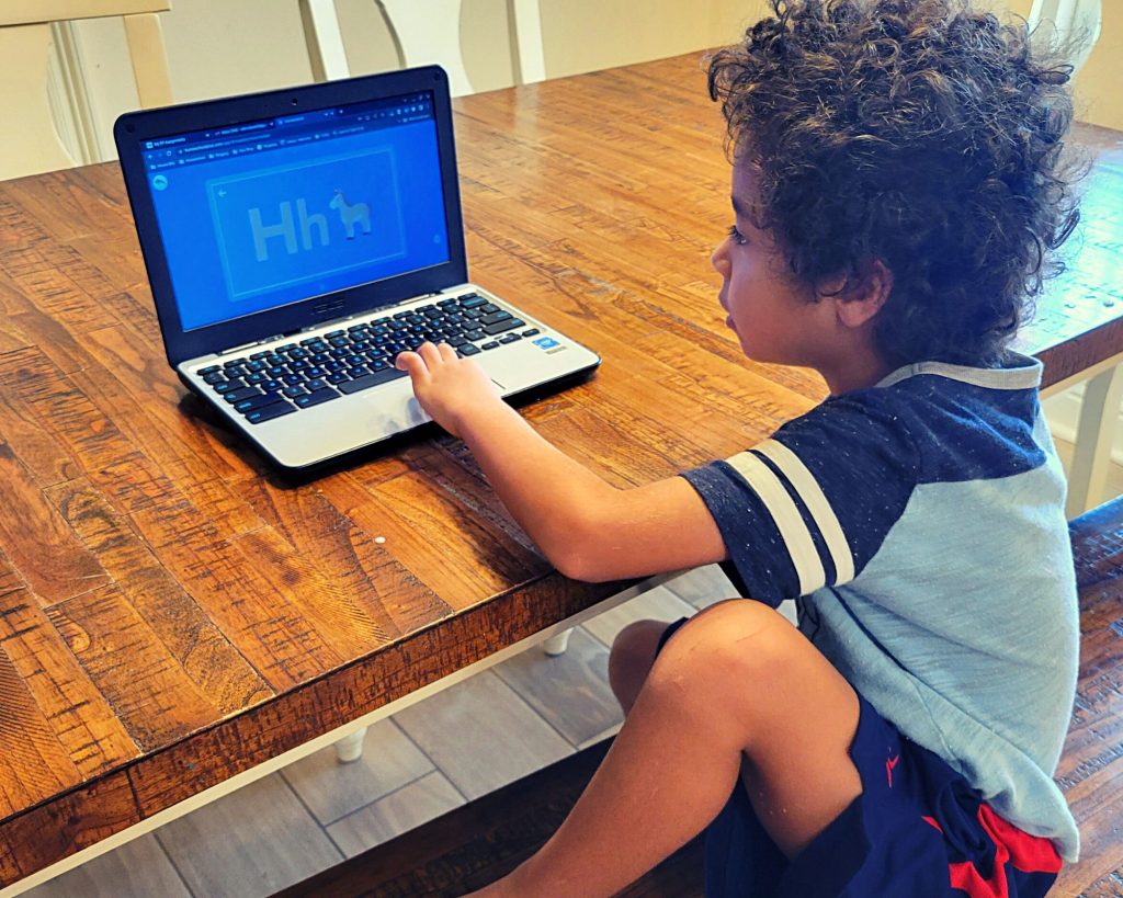 Boy using Homeschool+, an interactive online homeschool curriculum for Prek-2nd grade.