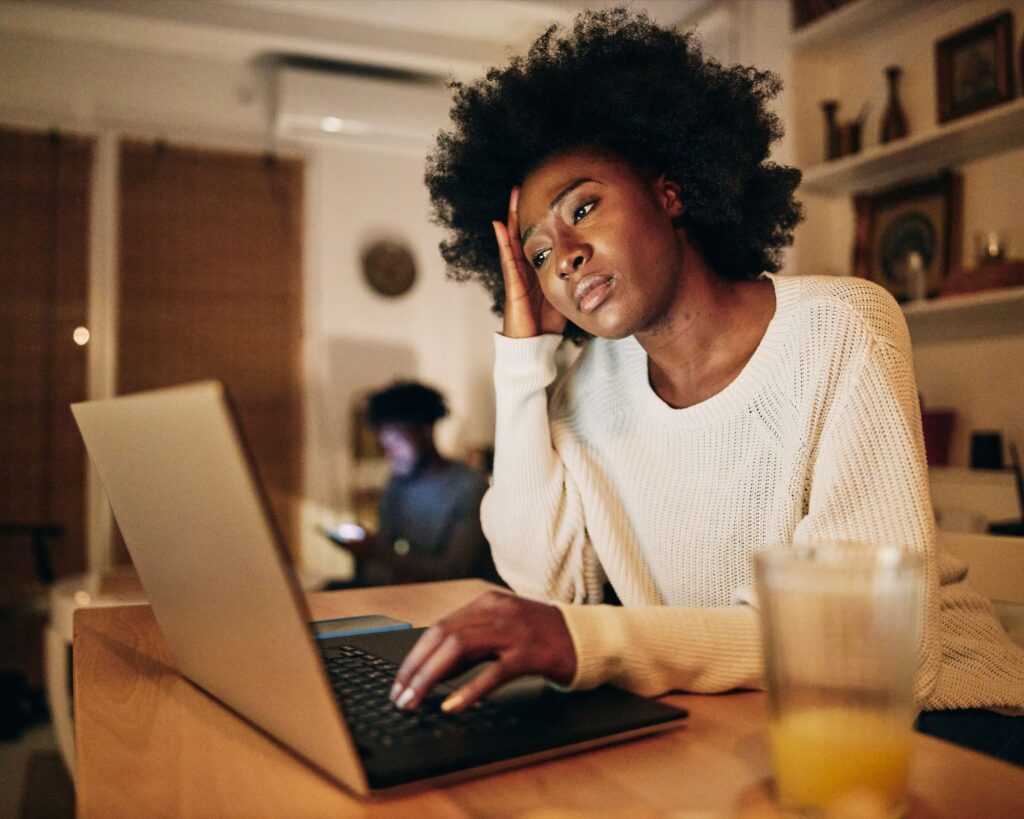 Woman looking at her computer.